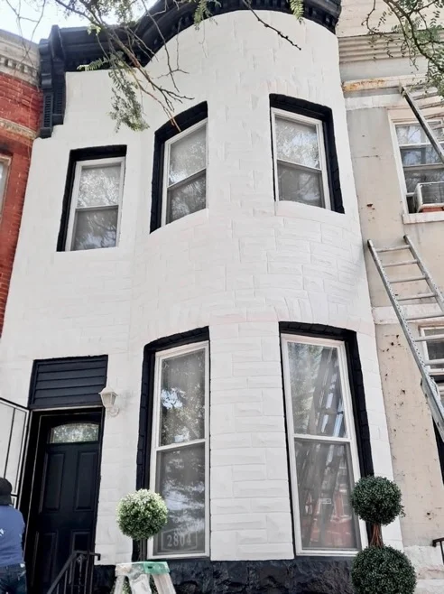 Row home in Baltimore with a fresh coat of weather resistant white exterior paint